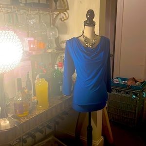 This is Dress barn classic. is roomy and full figure flattering long sleeves